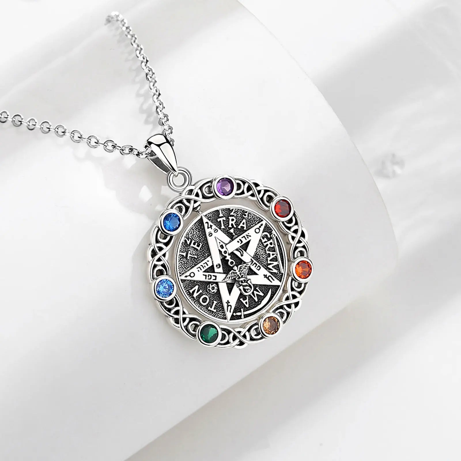 Colgante Tetragrámaton Giratorio Con Piedras De Los 7 Chakras De Plata.